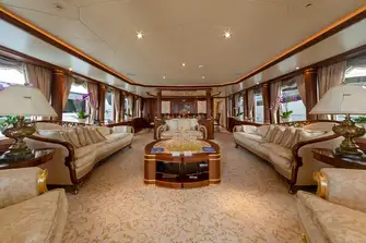 The main saloon is surrounded by big glass windows allowing for natural light to fill the space 