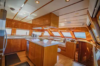 A family-style open-plan galley has a dinette and breakfast bar