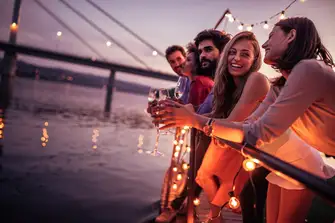 Network with a chilled glass of champagne in hand 