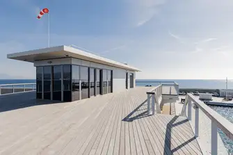 The yacht club's rooftop terrace has enviable views over the marina and the yachts anchored off due to no available berths. You could make one yours