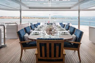 Open-air dining on the bridge deck aft