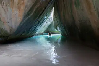 Swim through the hidden caves and grottos