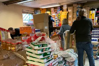 Hard at work in the busy aid store
